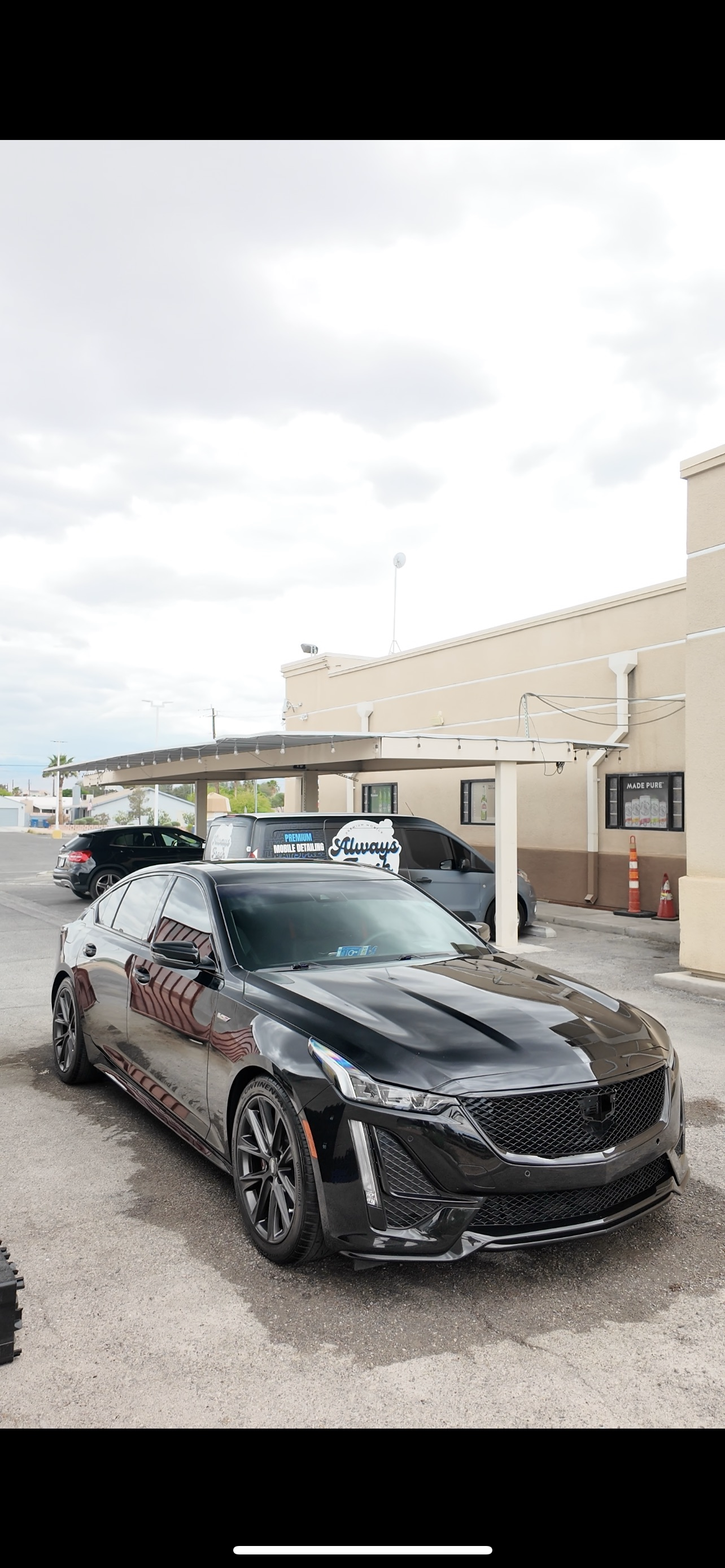 Black Cadillac with mirror finish ceramic coating in Las Vegas