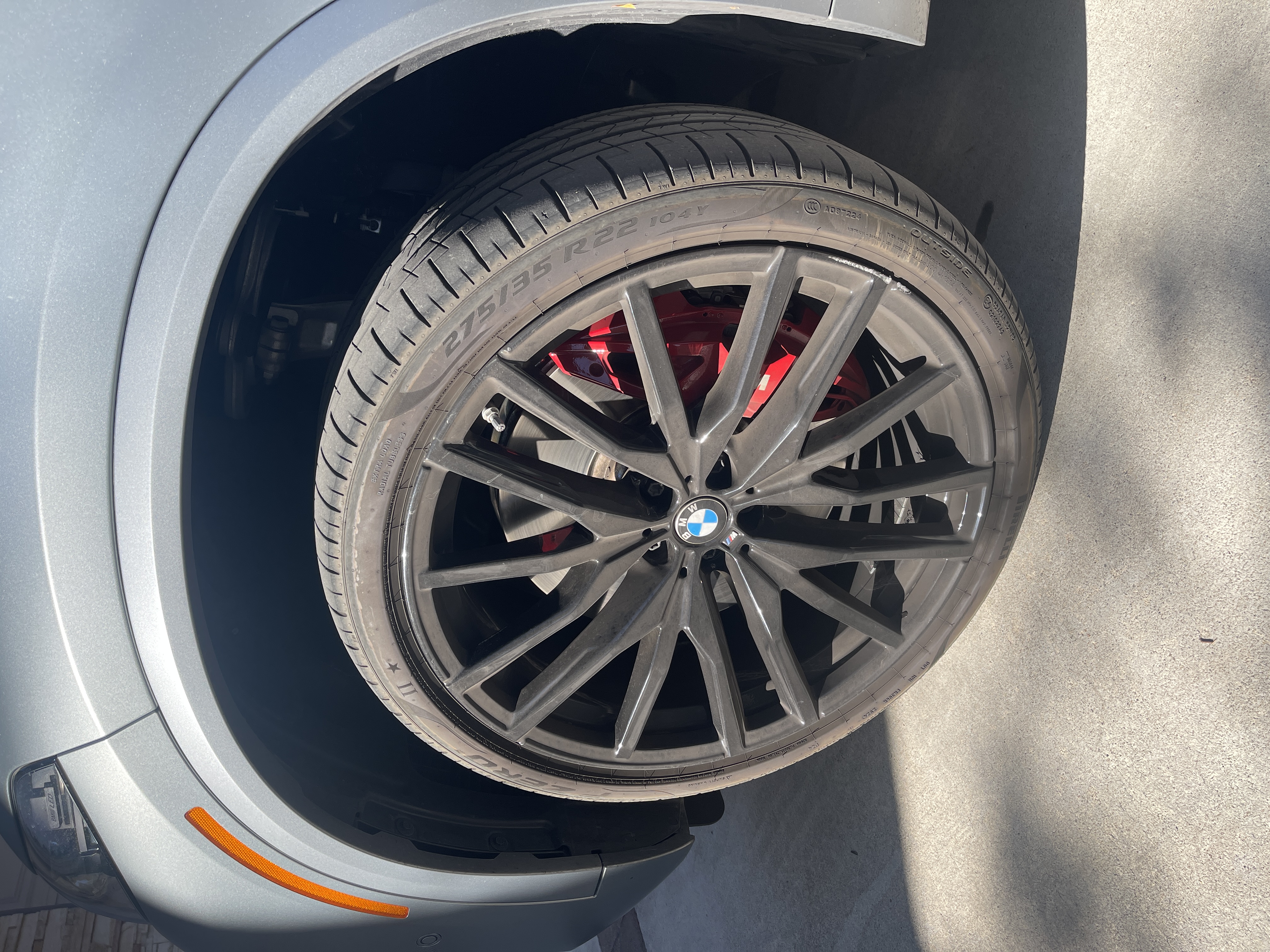 BMW wheel before detailing - swirl marks and contamination visible