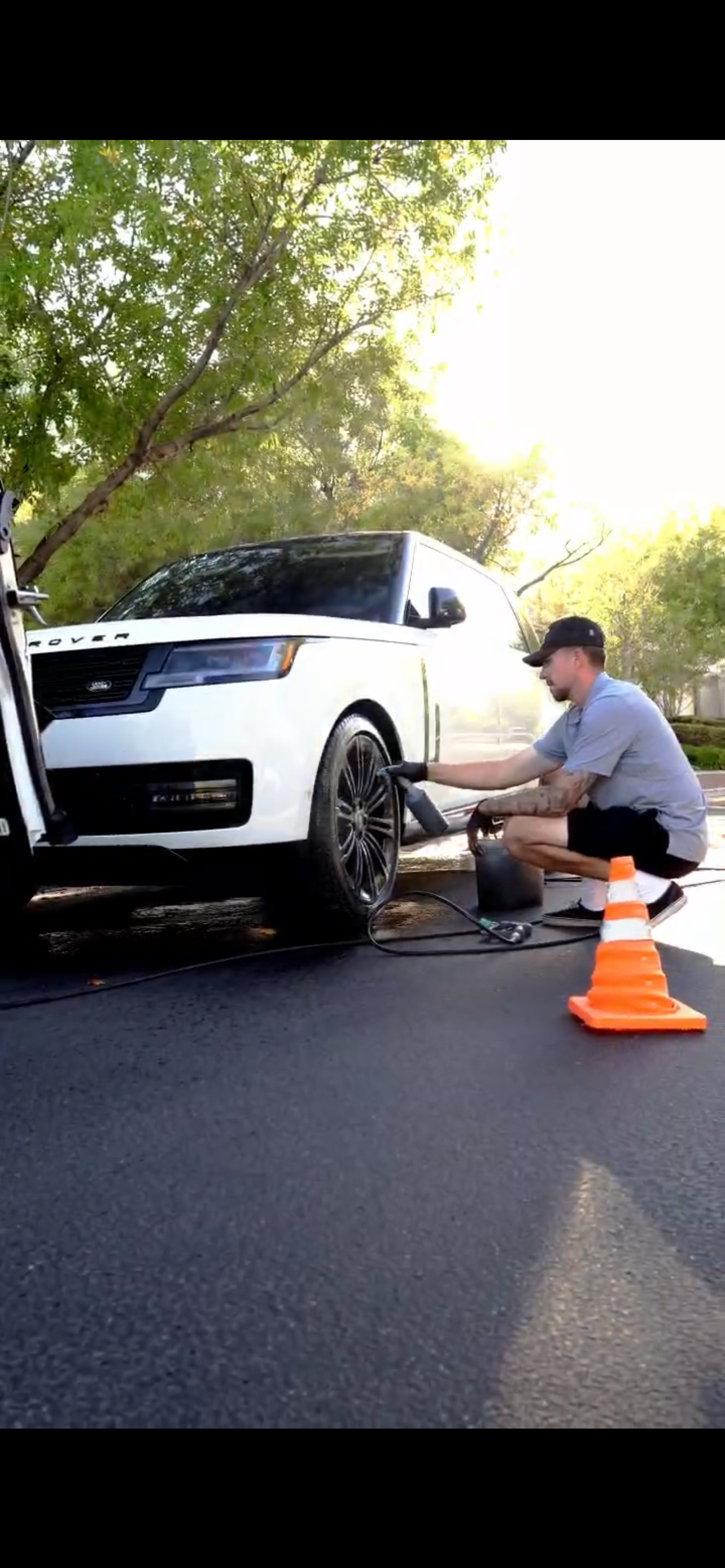 Range Rover wheel being detailed in Summerlin driveway